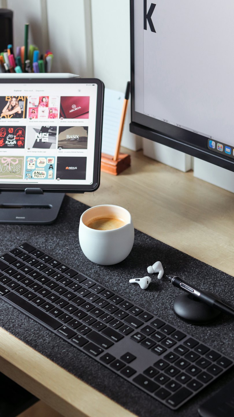 Modern office desk setup featuring a tablet and wireless accessories.